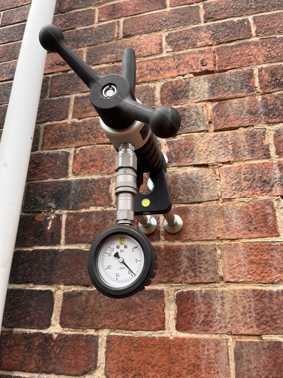 CSR's anchor pull tester set up on a scaffold tie